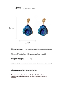 Detail view of 5.8cm blue oval resin earrings with gold textured metal and dimensions