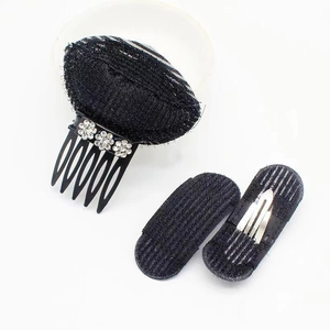 Detail of black hair padding tool set with rhinestones for volume and invisible styling