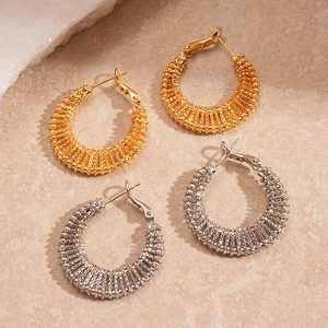 Textured hollow geometric C-shape hoop earrings in gold and silver metal finishes
