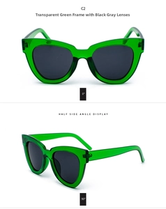 Front and side view of cat eye sunglasses with transparent green frames and dark grey lenses