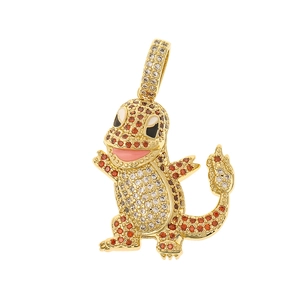 Macro detail of a gold-plated charm with orange and white crystals in dragon shape