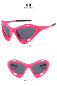 Detailed side and front views of pink futuristic Y2K sports sunglasses with aerodynamic cutouts