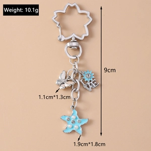 Detail view of silver keychain with blue starfish, butterfly, and LOVE charm pendants