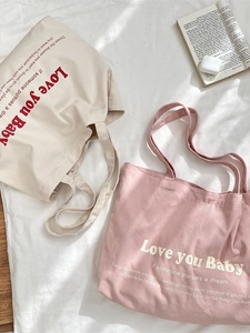 Minimalist canvas tote bags in white and pink with aesthetic lettering for daily commuting