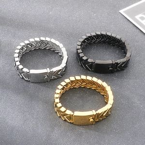 Detail view of V-shaped interlocking snake bone chains in gold, silver, and black finish