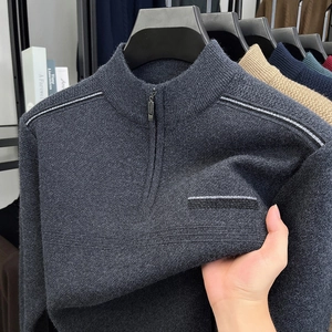 Detailed view of dark grey half-zip sweater showing the thick knitted texture and stripe pattern