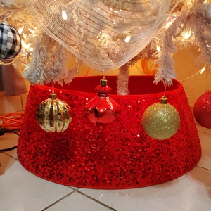 Sparkling red sequin Christmas tree collar skirt for festive holiday home decoration