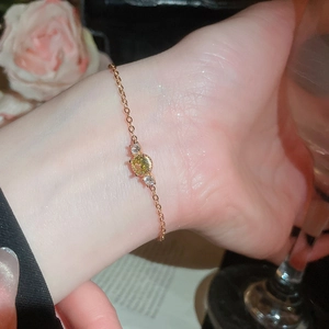 Rose gold pearl bracelet with zircon flowers shown on a wrist in lifestyle setting