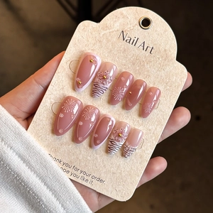 Pink zebra stripe press-on nails with 3D flowers, golden beads and artistic patterns