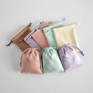 Detailed view of colorful velvet drawstring pouches for jewelry and small gift packaging