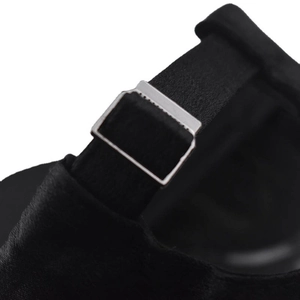 Macro detail of adjustable black fabric strap with silver metal buckle on baseball cap