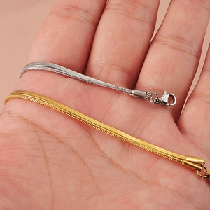 Dual-layer stainless steel snake chain bracelet in gold and silver finish with lobster clasp