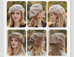 Detail showing high-quality wool fabric and premium metal pin on the beret hat