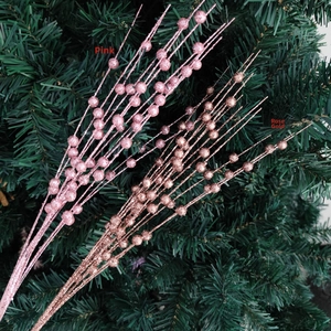Detail of pink and rose gold glitter berry picks for Christmas tree decoration