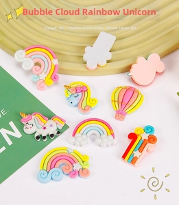 Macro detail of colorful pastel rainbow and unicorn resin charms for various DIY crafts