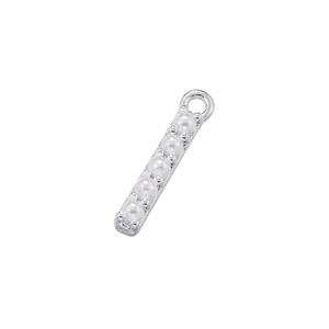 Macro shot of silver-plated bar pendant with five white pearls and top hanging ring