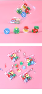 Close-up of four Christmas erasers in zipper bags with Santa, tree, and snowflake shapes