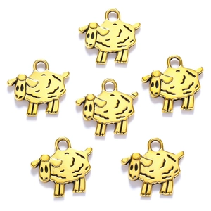Detailed view of six golden sheep charms made of alloy for DIY jewelry making