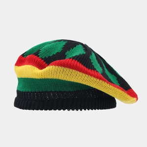 Macro detail of Rasta style knitted beanie showing colorful stripes and thick texture