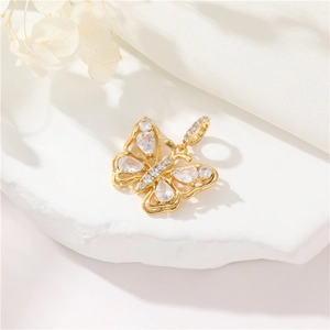 Elegant 14K gold butterfly pendant with sparkling cubic zirconia on white stone
