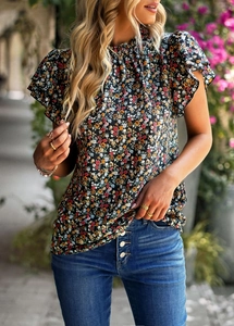 Detail of floral printed top featuring elegant ruffle short sleeves and a stylish high neck