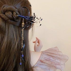 Close-up of a blue floral tassel hair stick worn in hair for a vintage Chinese look
