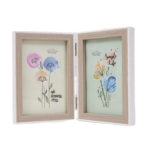 Double folding picture frame in white and light wood finish for 4x6 inch photos