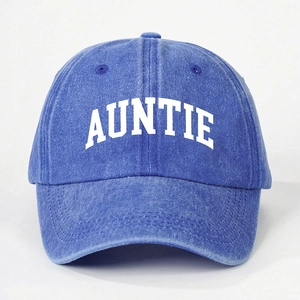 Close-up detail of the white AUNTIE text on a navy blue washed cotton baseball cap