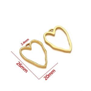 Detailed view of gold irregular heart-shaped metal pendant frames for DIY jewelry