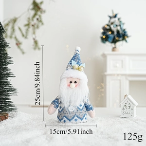 Blue knit Christmas gnome figurine with dimensions 25x15cm shown in cozy festive scene