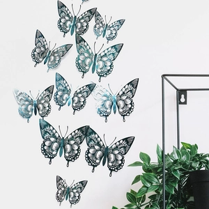 Detail of 3D hollow butterfly wall stickers with silver-blue metallic gradient finish