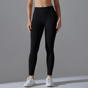 Close-up of black high-waisted seamless yoga leggings with elastic compression fabric