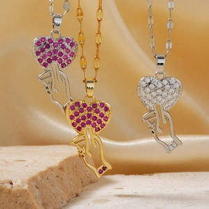 Luxurious heart-shaped hand gesture pendant necklace with sparkling cubic zirconia inlay
