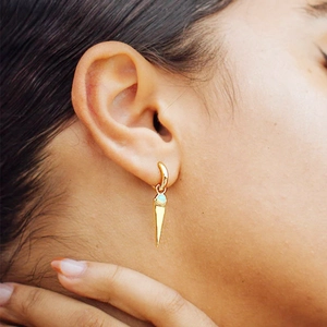 Detailed close-up of S925 silver hoop earring with blue opal and gold cone pendant