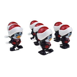 Set of 6 Christmas clockwork penguins in Santa hats and scarves for festive play