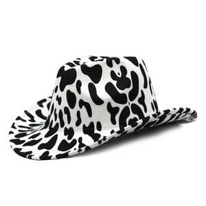 Close-up of the black and white cow print texture on thick felt western cowboy hat