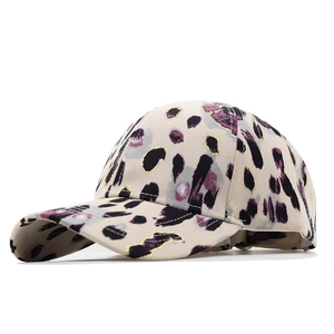 Detail of leopard print cotton baseball cap with purple spots and subtle gold shimmer