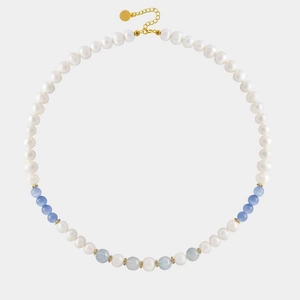Detailed macro view of heart pendant necklace with cat-eye and blue stone beads