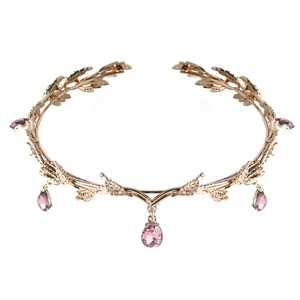 Detail of rose gold leaf bridal crown with sparkling rhinestones and pink teardrop gems