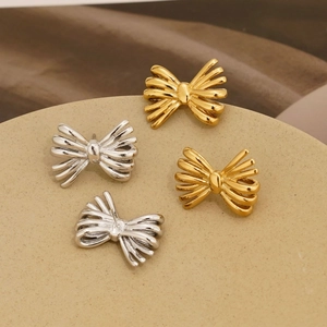 Polished stainless steel bow earrings in gold and silver finish set of two pairs