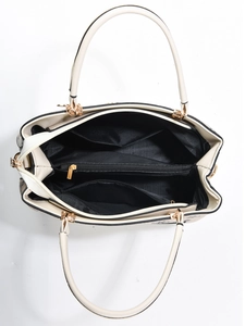 Detailed top view of women's tote bag interior with gold hardware and black lining