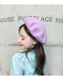 Side view of a soft purple wool beret showing premium fabric texture and stylish fit