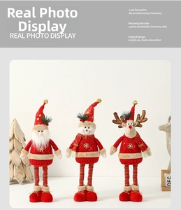 Detailed view of three stretchable Christmas dolls with red and gold festive holiday outfits
