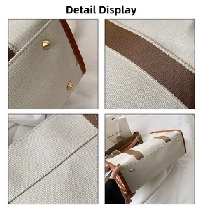Detail view of canvas tote bag with brown leather piping and protective gold base studs