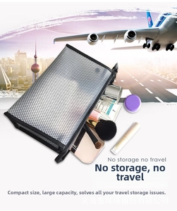 Detail view of black mesh travel toiletry bag with zipper showing interior cosmetic storage