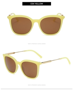 Detail of trendy hollow metal temples and yellow frame with brown lenses on sunglasses