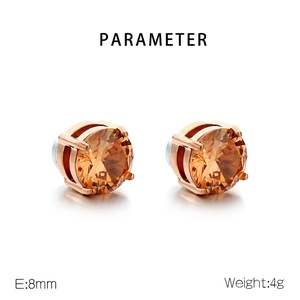 Detail showing 8mm rose gold magnetic stud earrings with faceted orange zircon stones