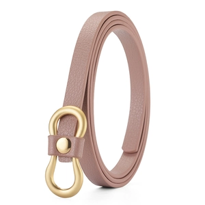 Close-up of pink PU leather skinny belt with golden figure-eight buckle for women