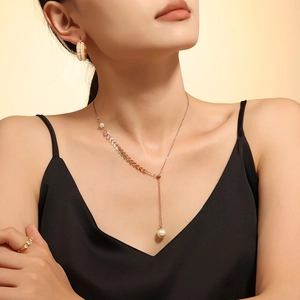 Elegant 18k gold plated wheat leaf necklace with pearl tassel pendant on model
