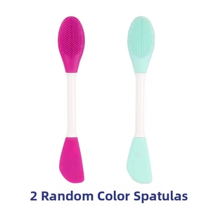Close-up of dual-ended silicone facial mask brushes with cleansing and spreading heads